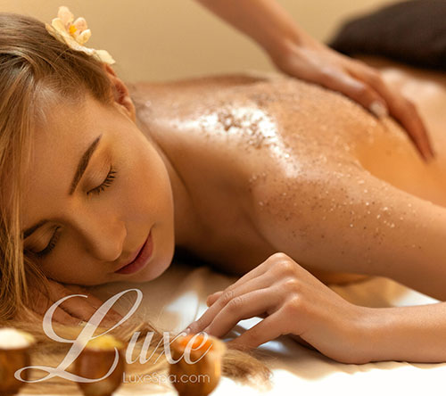 Women getting body scrub, Luxe Skin Scrub