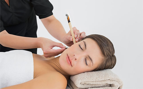 Women receiving an Ear Candling
